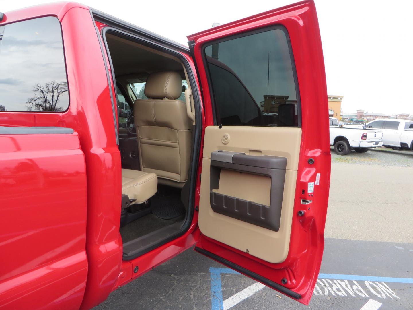 2014 Red /TAN Ford F450 Super Duty Crew Cab Lariat Crew Cab 4WD (1FT8W4DT7EE) with an V8 Turbo Diesel 6.7 Liter engine, Automatic 6-Spd w/SelectShift transmission, located at 2630 Grass Valley Highway, Auburn, CA, 95603, (530) 508-5100, 38.937893, -121.095482 - Wow!! 14 F450 sitting on Icon Vehicle Dynamics suspension, 24" American Force wheels, 37" tires, Rough Country back up leds, Light bar, Window tint, Smoked tail lights 3rd brake light, cab lights, and marker lights, Air bags with compressor, and train horns. Must see this head turner! - Photo#60